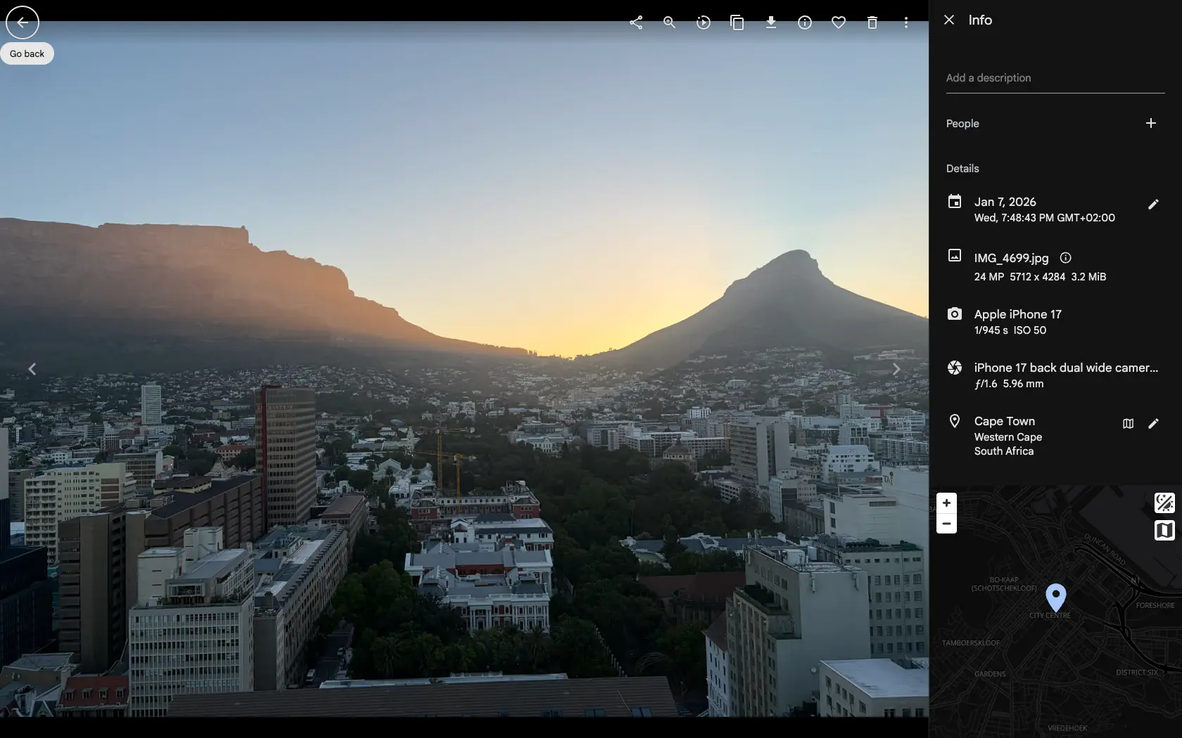 The Gallery asset viewer with the info panel open, showing a photo taken in Cape Town with its date, filename, camera, lens and location, each one clickable as a filter