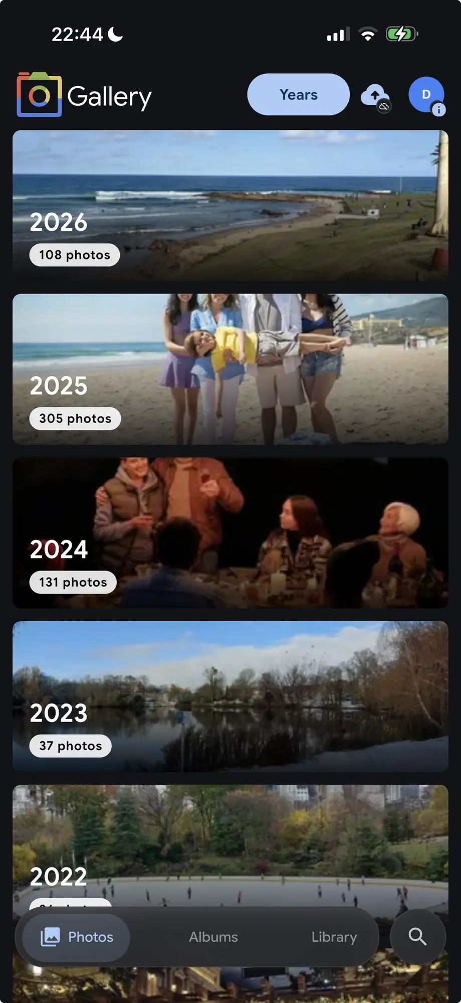 Noodle Gallery mobile app in Years grouping mode showing 2026, 2025, 2024, 2023, and 2022 as large cover-photo cards with photo counts